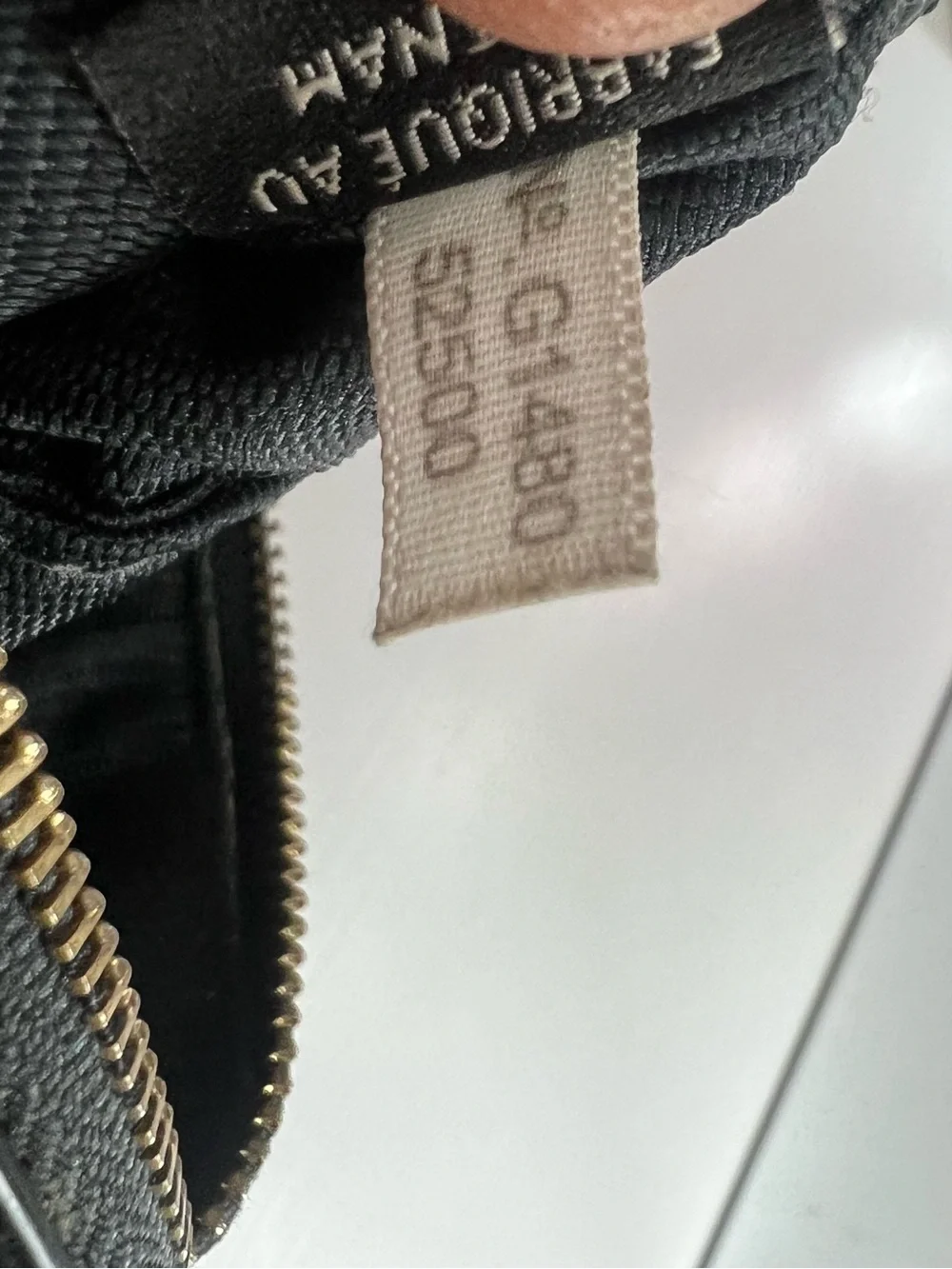 Coach Black Pebbled Leather Wristlet with Gold Floral Charm
